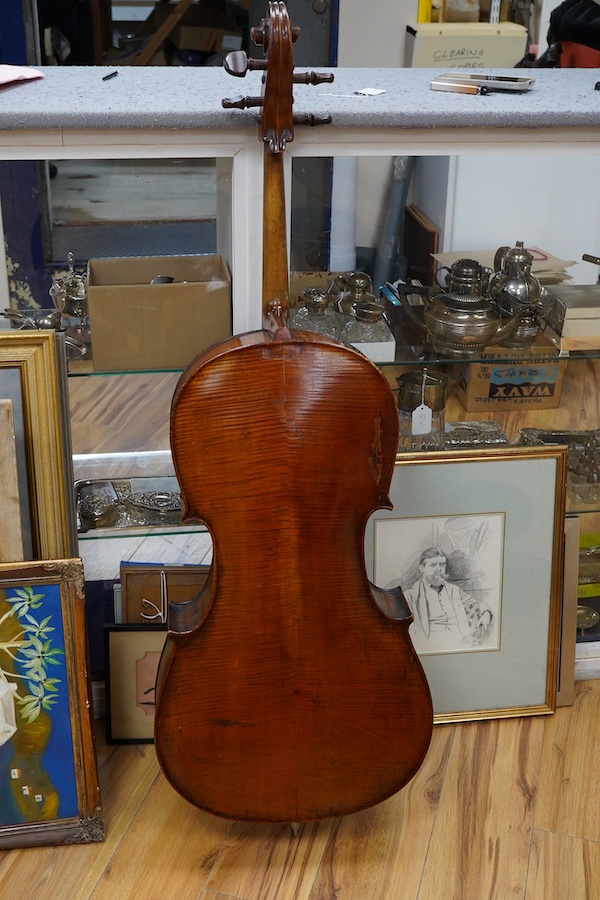 A cased late 19th century German? cello, body length 75cm, together with two bows. Condition - fair to good.